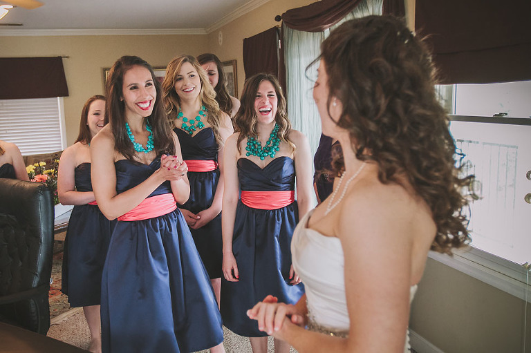 Bridesmaids thrilled to see the bride in her dress at Tennessee RiverPlace
