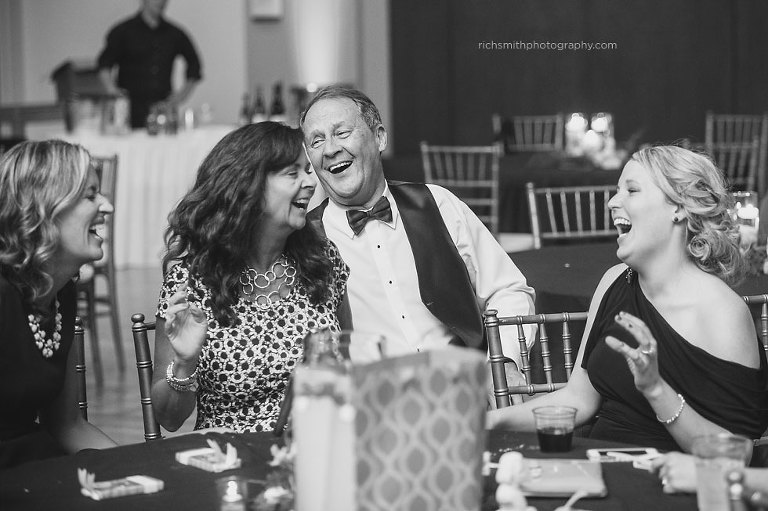 Guests laughing and having a great time during a wedding in Roswell, GA.