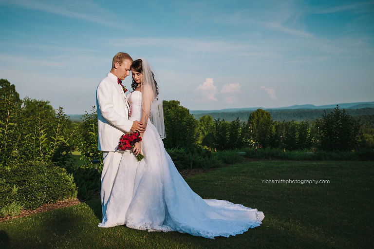 Bride and groom pose at Mountain View Gardens and Ballroom.