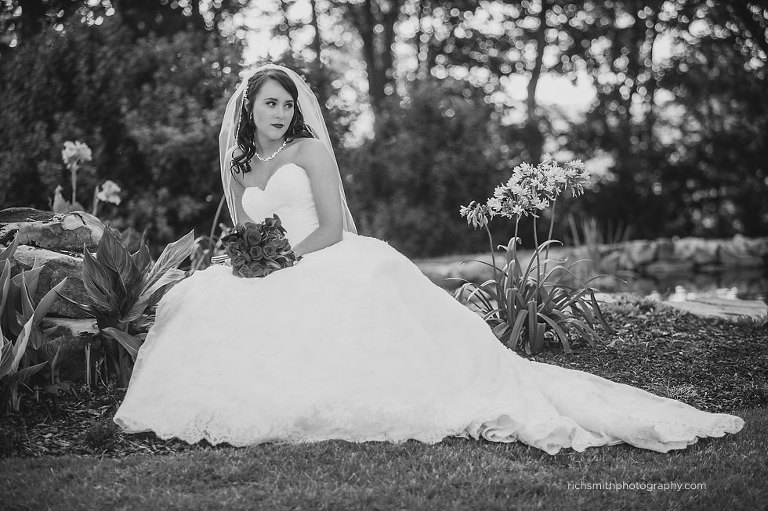 Bride sitting on a garden at Mountain View Gardens and Ballroom