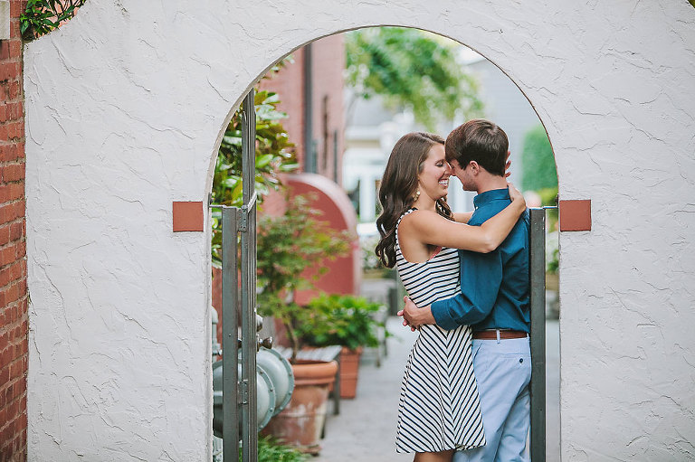 Kissing under an arch.