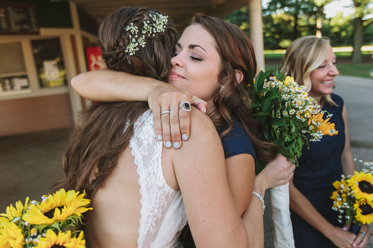 bride, sister, bridesmaid, hugging, wedding day