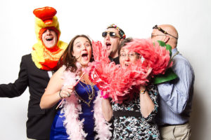 wedding guests going wild in photo booth