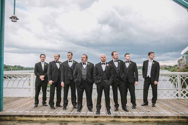 groom with his groomsmen on the walking bride in chattanooga