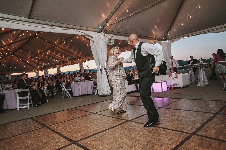 groom dancing with his mom and laughing 
