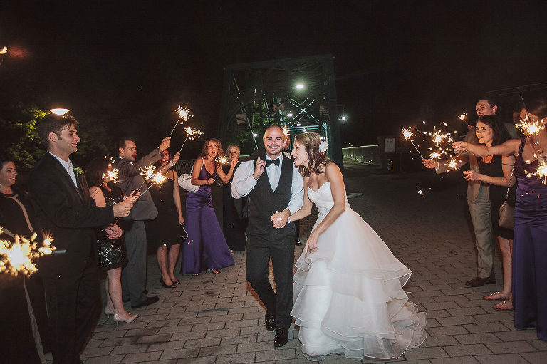 bride and groom exit after reception with sparklers