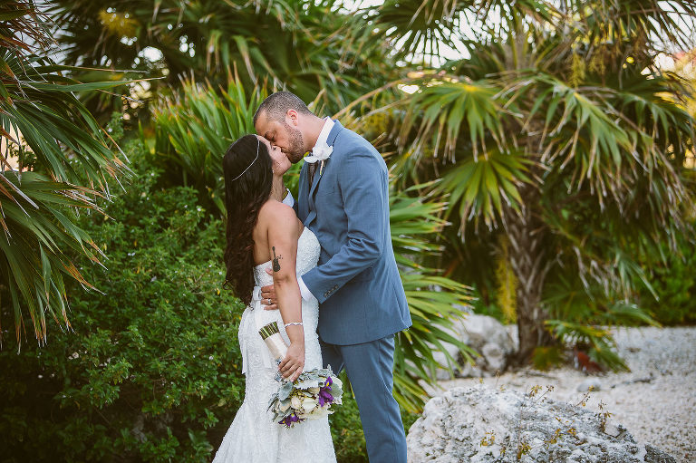 bride and groom kissing outdoors at hard rock hotel riviera maya, Mexico