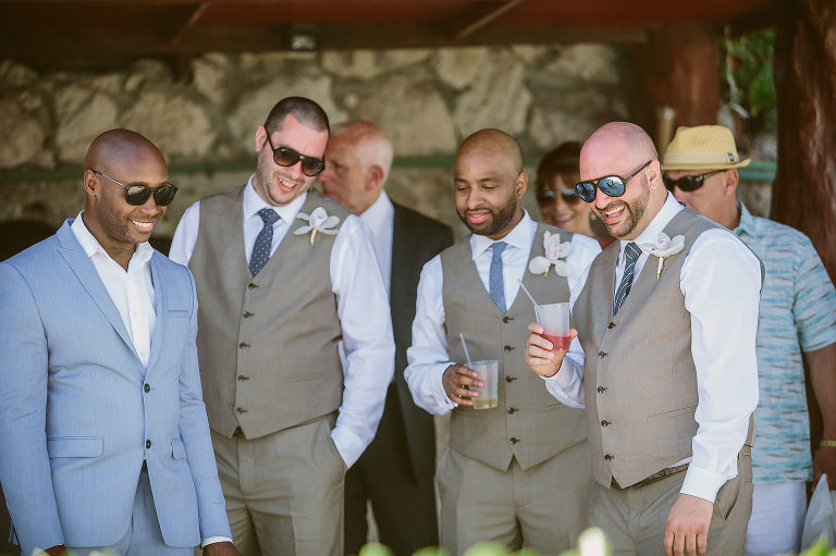 groomsmen laughing and waiting for ceremony to begin