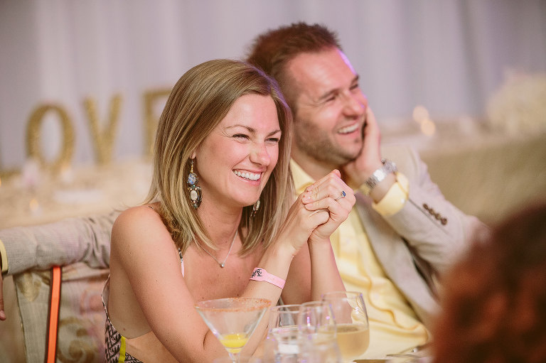 wedding guests laughing 
