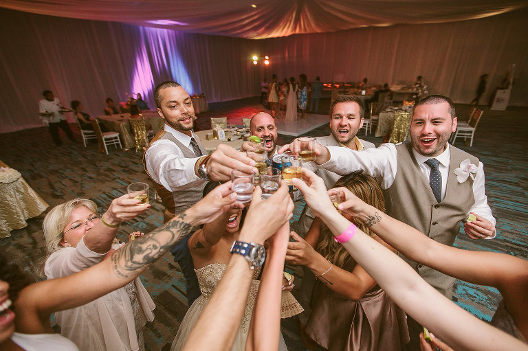 wedding party toasting and doing shots
