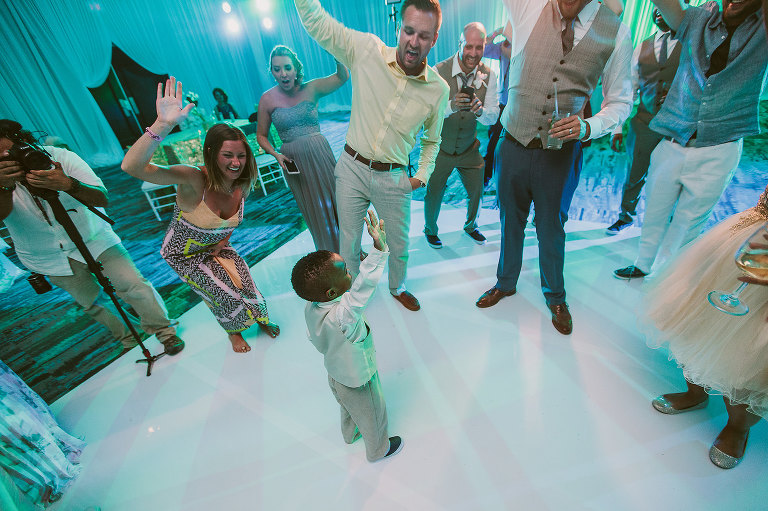 wedding guests and ring bearer dancing 