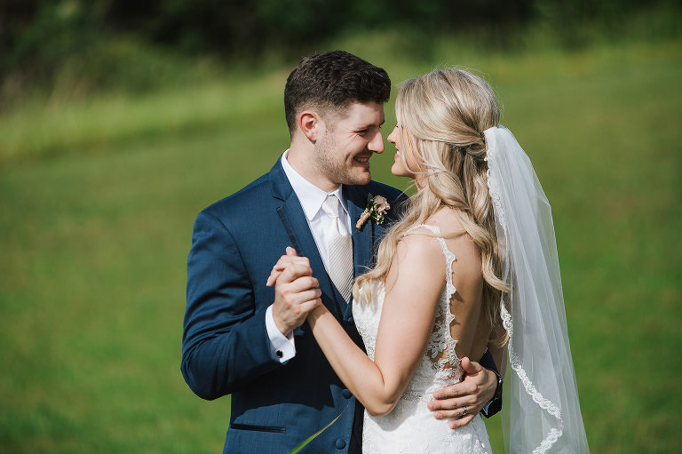 bride and groom holding hands portrait