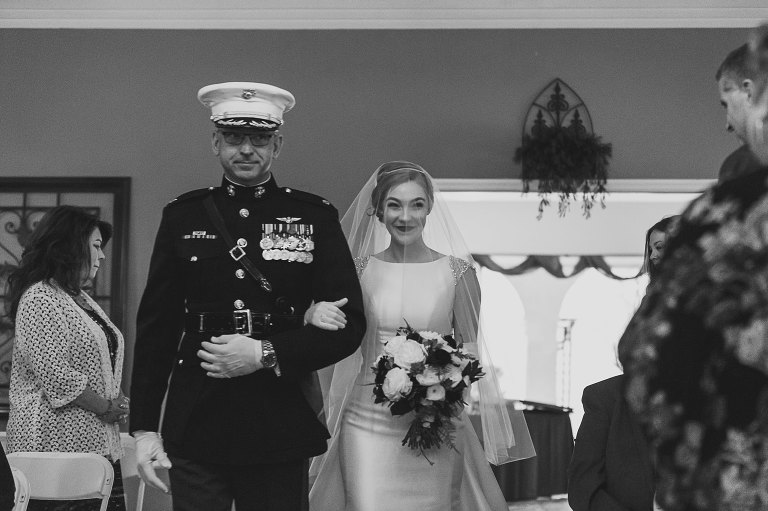 bride being walked down the aisle by her military father 