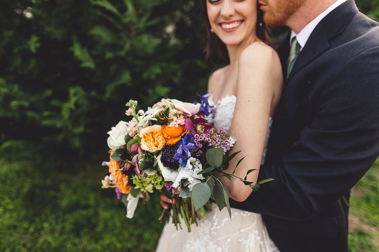 bride and groom with flowers bouquet