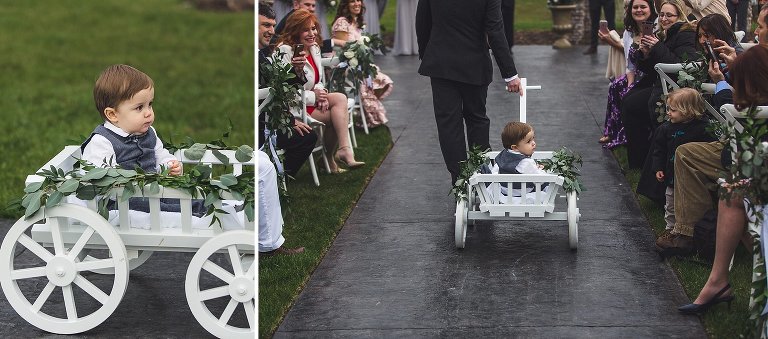 Ring Bearer bring rolled down the aisle in wagon