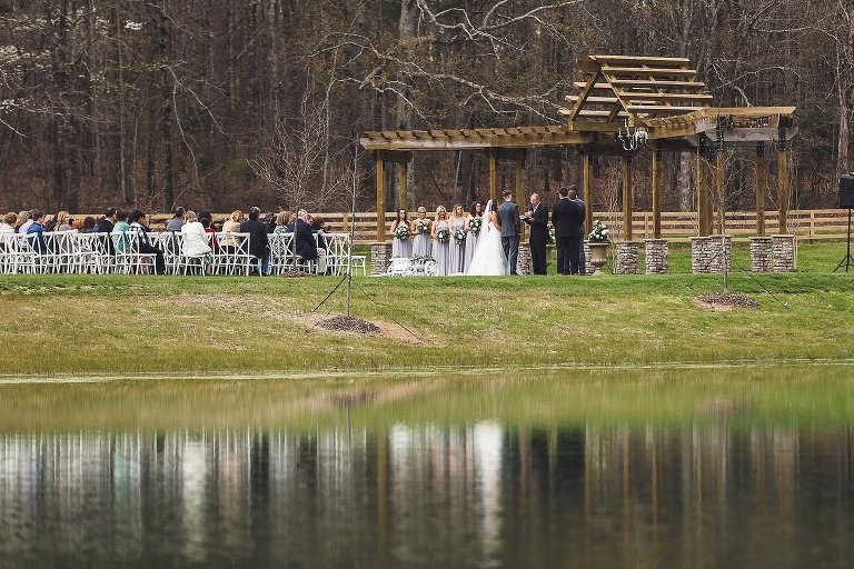 ceremony reflected in pond