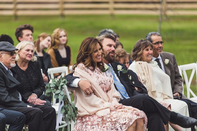 mother of bride smiles during ceremony