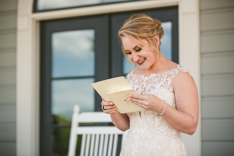 bride reading a card from groom