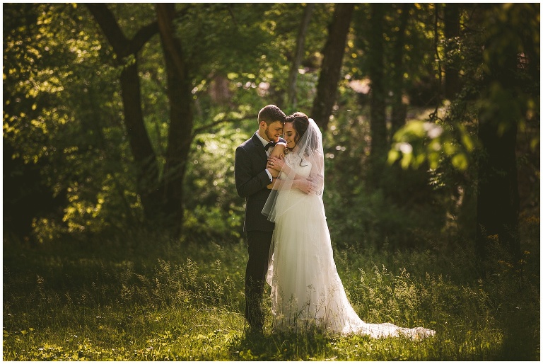 bride and groom portrait in forest 