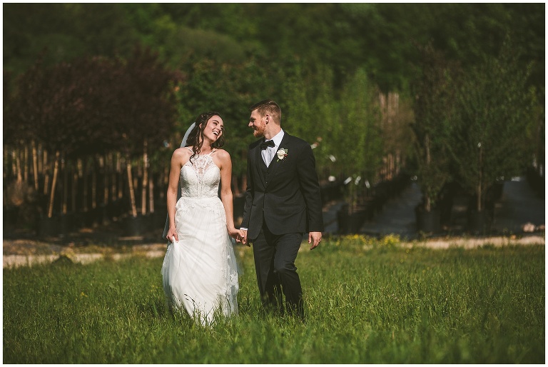 bride and groom portrait in field 