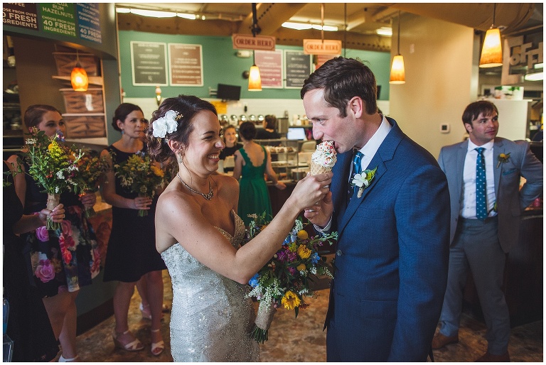 bride and groom eating ice cream cone