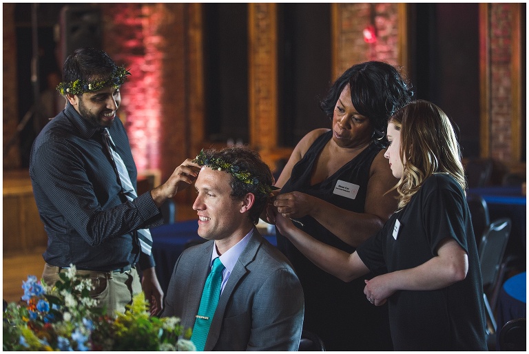 groomsmen getting ready with flower crowns funny