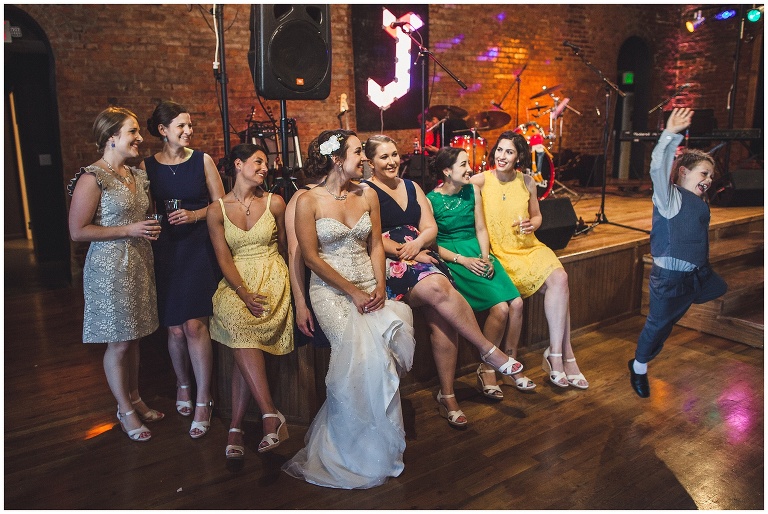bride and bridesmaids laughing 
