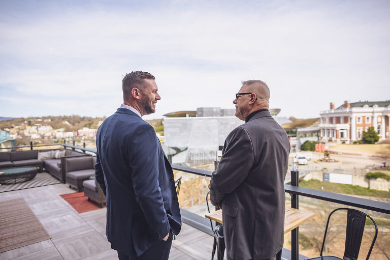 groom overlooking downtown chattanooga with family member