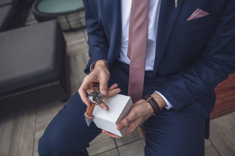 groom with new watch from bride