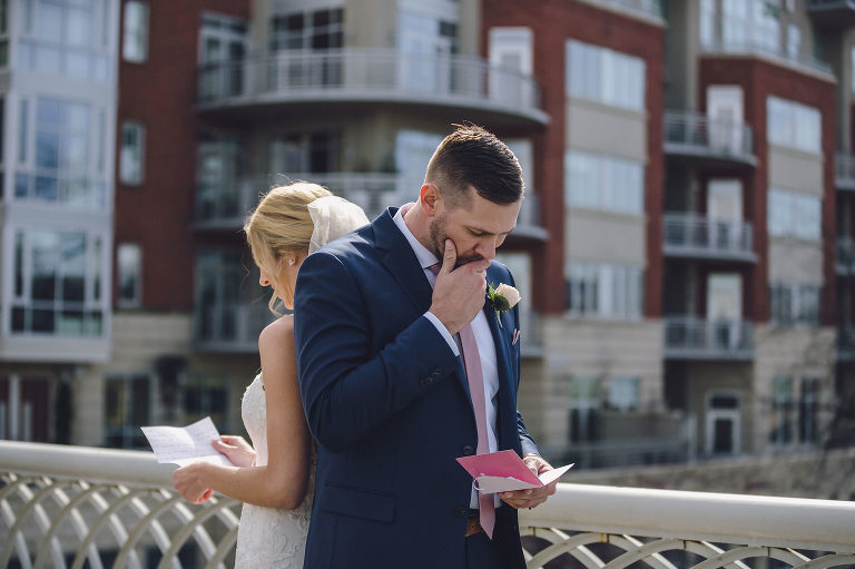 bride and groom reading letters back to back