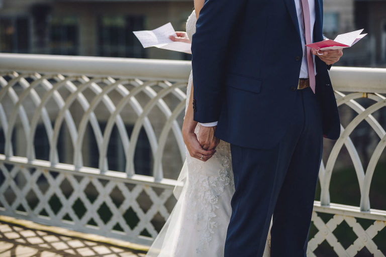 bride and groom holding hands