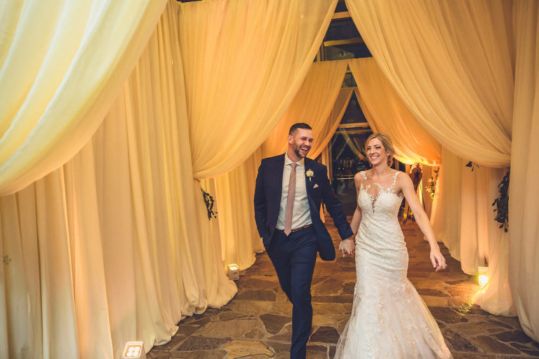 bride and groom being introduced into reception