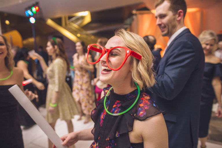 wedding guest dancing with glow sticks