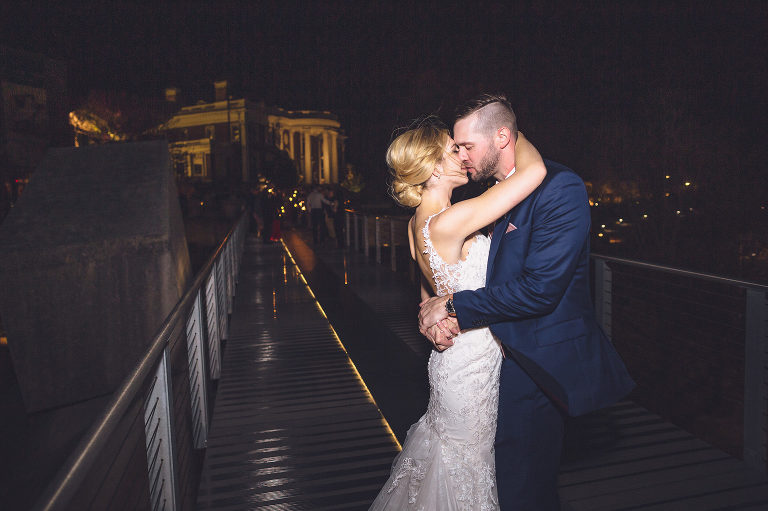 bride and groom kiss on glass bridge chattanooga 