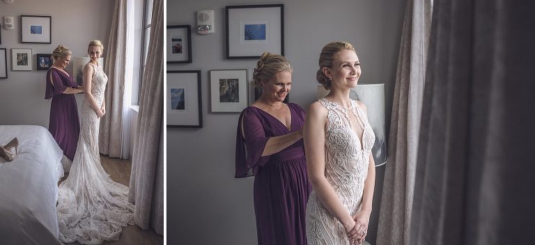 bride with her mom getting wedding Dress buttoned