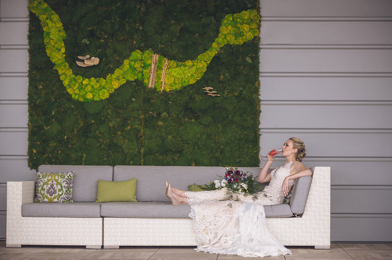 bride with drink on sofa at Edwin