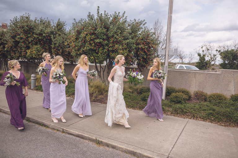 bride and bridesmaids walking in art district chattanooga